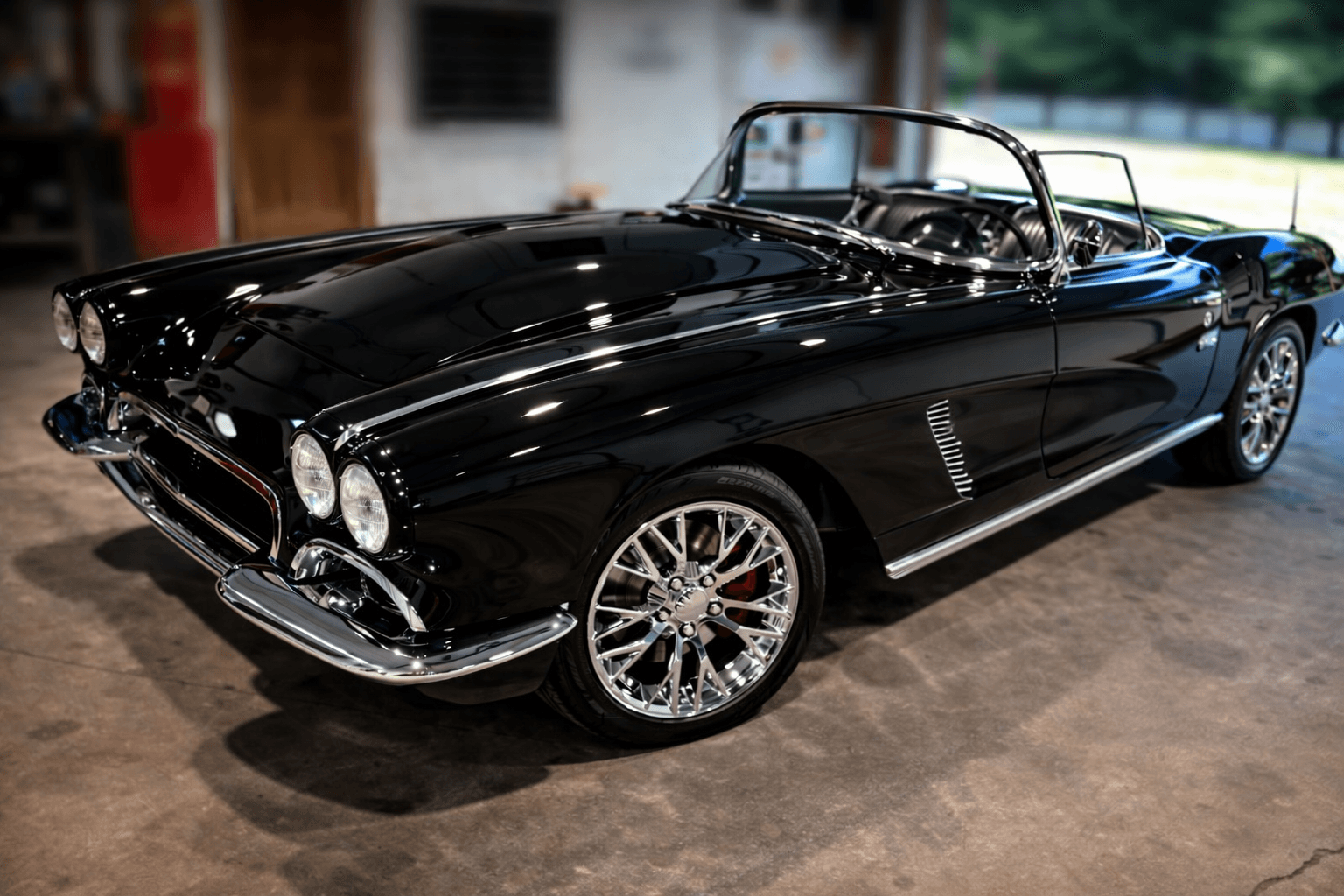Classic black Corvette detailed inside garage