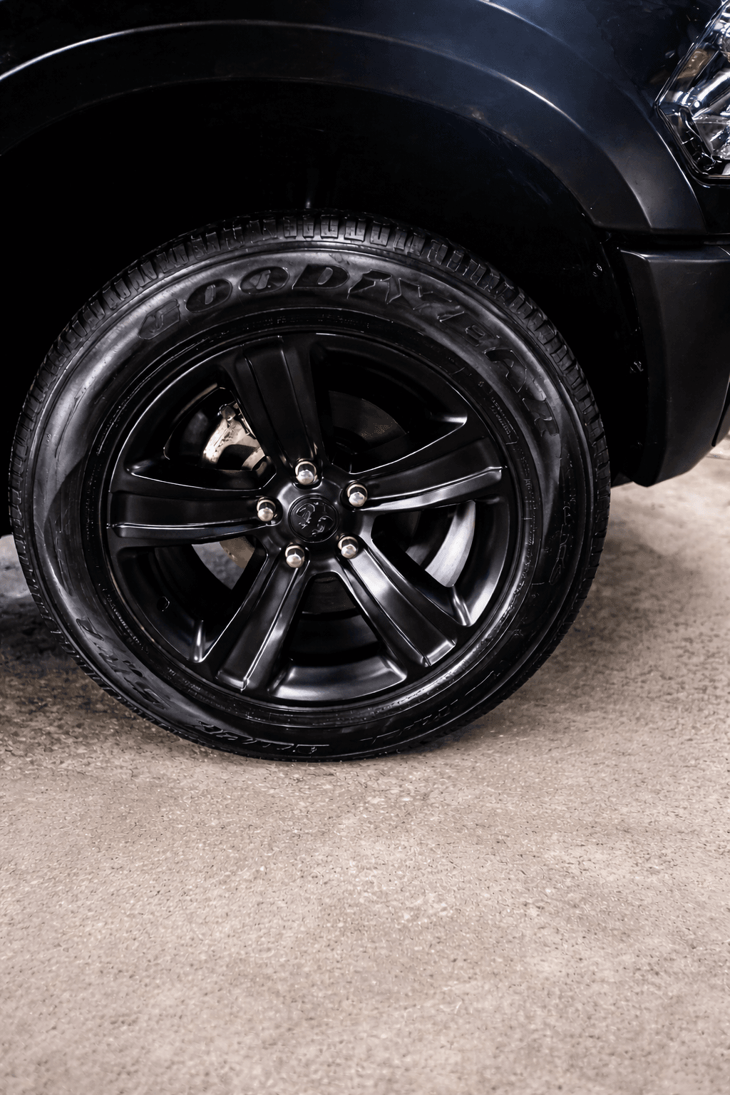 Glossy black alloy wheel and tire after detailing