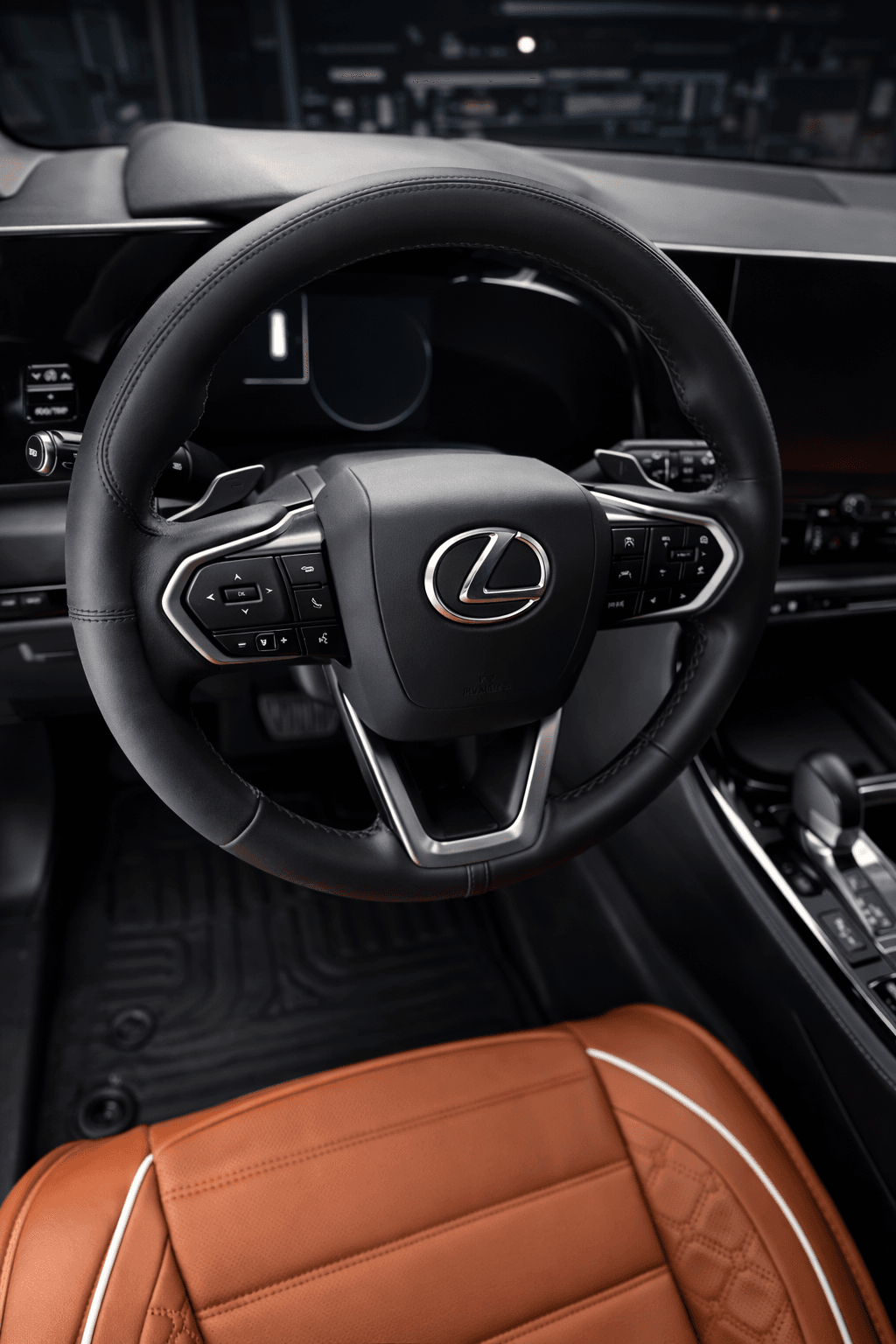 Lexus interior close-up showing steering wheel and premium seat